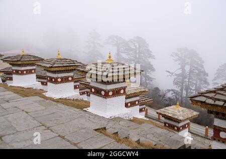 Dochu La (Pass) with 108 chortens (stupas), built in 3 layers on a central hillock, along the east-west road from Thimpu to Punakha, Bhutan Stock Photo