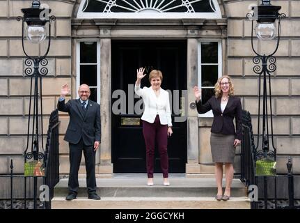 File photo dated 30/08/21 of First Minister Nicola Sturgeon (centre) welcoming Scottish Green co-leaders Patrick Harvie and Lorna Slater at Bute House, Charlotte Square, Edinburgh, following their Government Ministerial appointments. Nicola Sturgeon set out details of her Government's deal with the Greens as Holyrood returns after the summer recess. Issue date: Tuesday August 31, 2021.