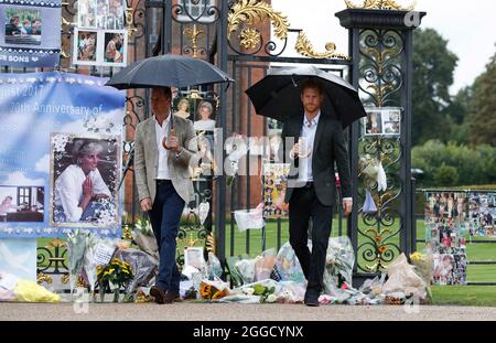 File photo dated 30/8/2017 of the Duke of Cambridge and Prince Harry depart after viewing tributes to Diana, Princess of Wales attached to the Golden Gates of Kensington Palace, London, ahead of the 20th anniversary of their mother's death. Twenty four years have passed since Diana, Princess of Wales died in a Paris car crash. The princess - the Duke of Cambridge and the Duke of Sussex's late mother - was just 36 was she was killed on August 31 1997. Issue date: Tuesday August 31, 2021.