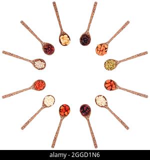 Top view group of various types of dried fruits on a wooden spoon isolated on white background. Stock Photo