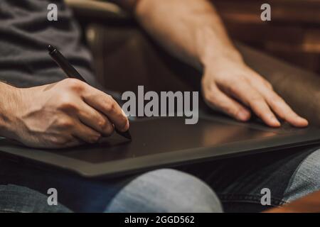Close Up of a Person Drawing on a Graphics Tablet Stock Photo