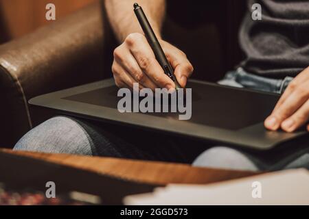 Close Up of a Person Drawing on a Graphics Tablet Stock Photo