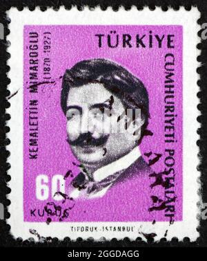 TURKEY - CIRCA 1965: a stamp printed in Turkey shows Kemalettin Mimaroglu, architect, circa 1965 Stock Photo