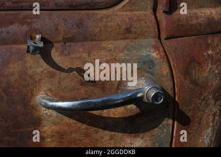 close-up of a chrome door handle of an old rusty car Stock Photo