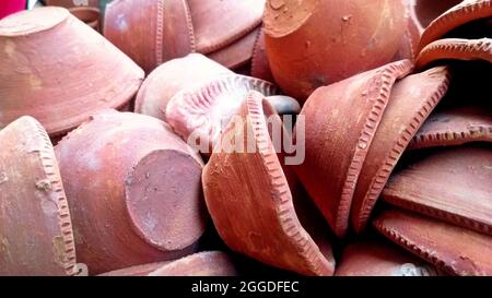 Close up of heap of Indian clay oil lanterns or diya ready to be sold in market during Diwali in India Stock Photo