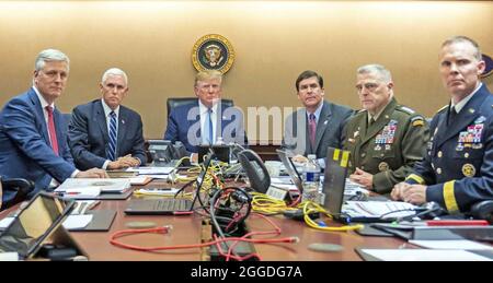 DONALD TRUMP as US President in the White House Situation Room in October 2019 during the operation to kill Islamic State leader Abu Bakr al-Baghdadi. From left: U.S. National Security Advisor Robert O'Brien, Vice President Mike Pence, Trump, Defence Secretary Mark Esper, Chairman Mark Milley, Brigadier General Marcus Evans. Photo: White House Official