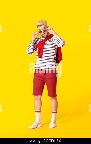 Handsome young man on color background Stock Photo