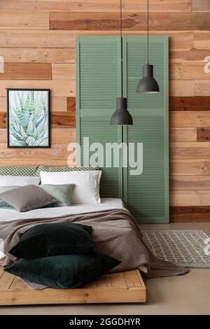 Interior of stylish room with comfortable bed Stock Photo