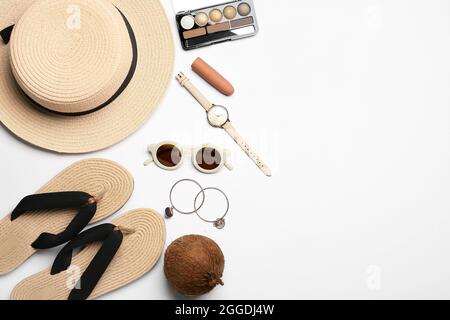 Set of female accessories, cosmetics and coconut on white background Stock Photo