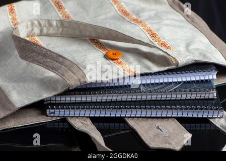 bag made of fabric with notebooks. Stock Photo