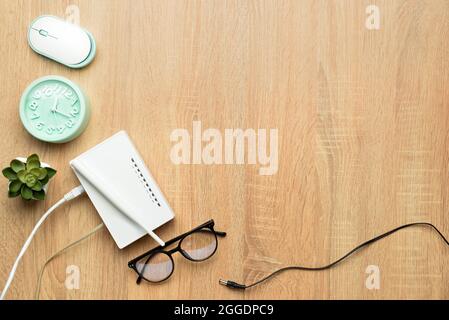 Composition with modern wi-fi router on table Stock Photo