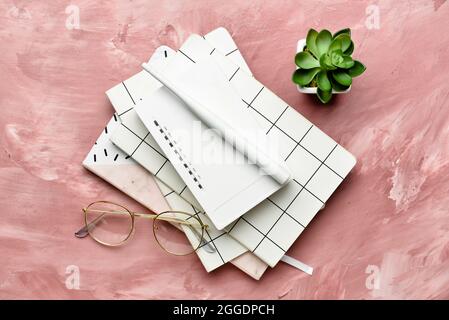 Composition with wi-fi router and stationery on color background Stock Photo