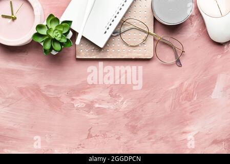 Composition with wi-fi router, speaker, clock, PC mouse and notebook on color background Stock Photo