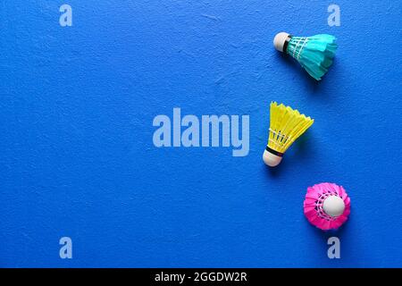 Badminton shuttlecocks on color background Stock Photo