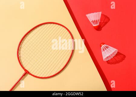 Badminton racket and shuttlecocks on color background Stock Photo
