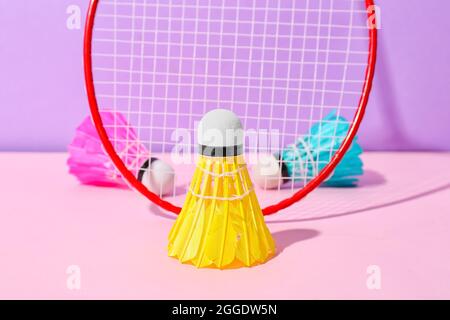 Badminton racket and shuttlecocks on color background Stock Photo