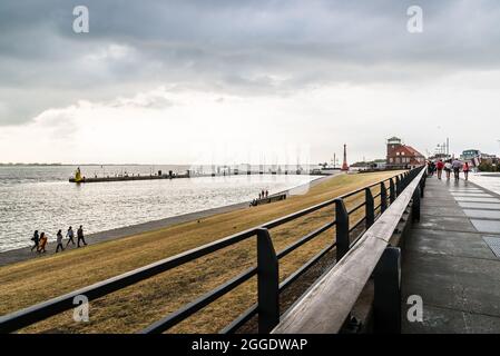 Bremerhaven, Germany - August 6 2019: Promenade in the port of Bremerhaven a stormy day of summer at sunset Stock Photo