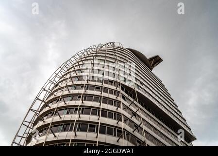 Bremerhaven, Germany - August 6 2019: Atlantic Hotel Sail City a stormy day of summer. Low angle view Stock Photo