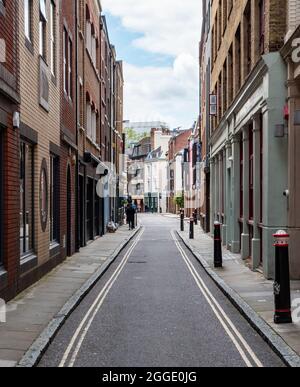 City of London side street. A narrow side road with a contrast of old and new architecture in EC1. Stock Photo