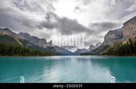 Turquoise blue glacial lake Maligne Lake, mountains Mount Paul, Monkhead and Mount Warren in the back, Maligne Valley, Jasper National Park National Stock Photo