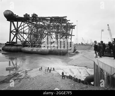 A view of the oil platform Graythorp I lying in the dry dock at Graythorp during the flooding of the basin. In the early 1970s Laing Pipelines Offshore constructed the Graythorp fabrication yard and dry dock on the site of the old William Gray Shipyard. The company created a dry dock which was used for the construction of fixed platform North Sea drilling rigs for the BP North Sea Oil Project. Graythorp I had its christening ceremony on June 4th and was launched on Saturday 29th June 1974, heading off for the Forties Oil Field 250 miles away.