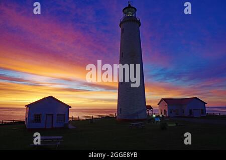 Lighthouse and building, Cap-des-Rosiers lighthouse, Gaspesie, Quebec, Canada Stock Photo