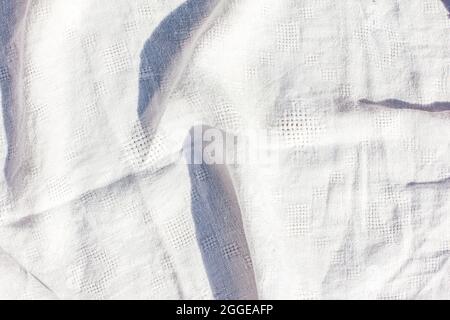 Light beige linen textile background with pleats. Empty space for copying Top view Stock Photo