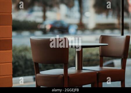 Empty Outdoor Restaurant Café with Street View Table and Chairs for Two People Stock Photo