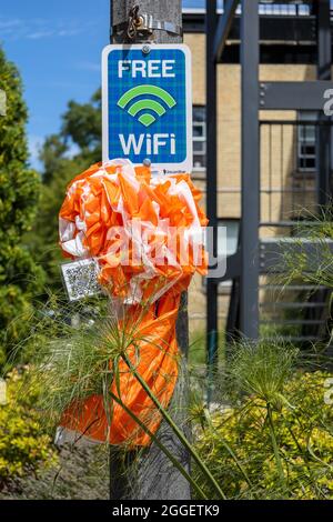 Free WiFi Sign On A Post With Rosette In Kincardine Ontario Canada Free WiFi Hotspot Is Available In The Downtown BIA Area Stock Photo