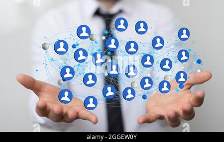 3D rendered profile icons hovering over the person's hands. Stock Photo