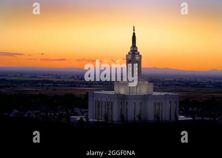 Pocatello Idaho LDS Mormon Latter-day Saint Temple with lights at sunset Angel Moroni Stock Photo