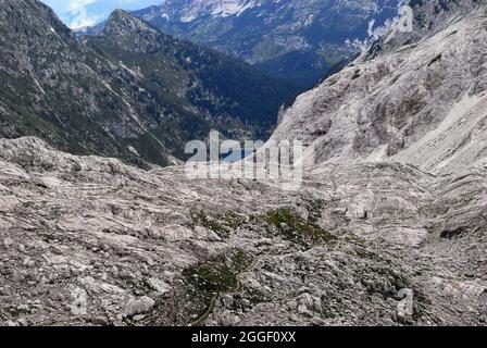 Slovenia, a view of Lepena valley from Mount Krn (monte Nero Italian) They were scene of bloody battles between the Alpini and the Kaisejager during the WWI.  Krnsko jezero lake in the valley. Stock Photo