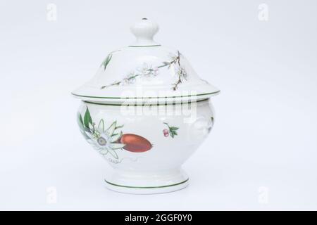 Floral patterned porcelain sugar bowl with lid. white background. isolated. selective focus. Stock Photo