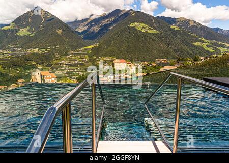 Thermal pool in the wellness area on the roof of the Hotel Hohenwart with a wide view of the landscape around Schenna in South Tyrol, Italy Stock Photo