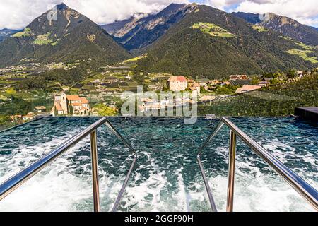 Thermal pool in the wellness area on the roof of the Hotel Hohenwart with a wide view of the landscape around Schenna in South Tyrol, Italy Stock Photo