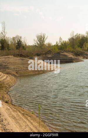 Sand quarry, lagoon Industry Mountains landscape Stock Photo