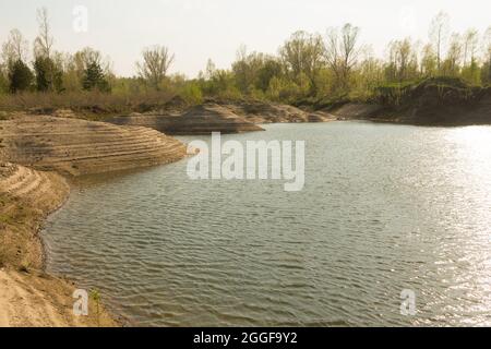 Sand quarry, lagoon Industry Mountains landscape Stock Photo