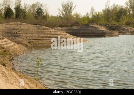 Sand quarry, lagoon Industry Mountains landscape Stock Photo