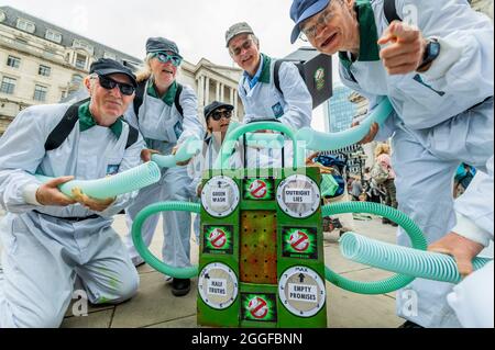 London, UK. 31st Aug, 2021. The 'Greenwash Busters perform a routinefor the remaining children - Extinction Rebellion continues its two weeks with a protest with a protest outside the Bank of England, under the overalll Impossible Rebellion name. Credit: Guy Bell/Alamy Live News