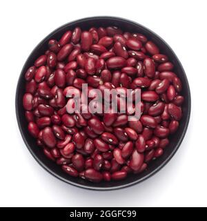 macro Close-up of Organic Rajma,  (Laal Lobia ) or red kidney beans dal on a ceramic black bowl. Top view Stock Photo