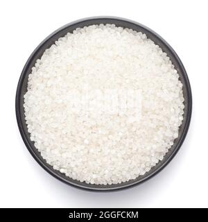 Top view Macro close-up photography of small-sized organic white sago or sabudana in a black ceramic bowl, showcasing intricate details. Stock Photo