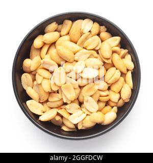 Close up of crunchy roasted Peanuts Indian namkeen (snacks) on a ceramic black bowl. Top view Stock Photo