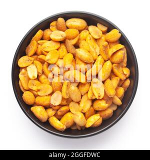 Close up of Crunchy masala peanuts Indian namkeen (snacks) on a ceramic black bowl. Top view Stock Photo