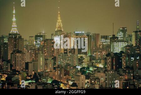 Sao Paulo cityscape at night - TV towers of Paulista Avenue ( Avenida Paulista ) in the background and downtown area in the foreground - financial and business center. Stock Photo