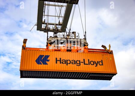 Crane operator picking up a Hapag-Lloyd sea container in the Port of Rotterdam. September 6, 2015 Stock Photo