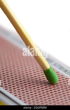 Green Match Striking Box on White Background. Stock Photo