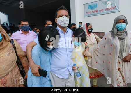Bangladeshi American Sharif Imran and his two Japanese daughters coming out from The High Court after a hearing, in Dhaka, Bangladesh, August 31, 2021. The High Court on Tuesday asked the Bangladeshi American Sharif Imran and his Japanese wife Nakano Eriko to stay with their children at a rented house in Gulshan-1 of Dhaka for the next 15 days. On 19 August, Nakano Eriko, a citizen of Japan, filed a petition with the High Court seeking its directives to return back her two daughters Jasmine Malika, 11 and Laila Lina, 10, from their Bangladeshi father Sharif Imran. (Photo by Suvra Kanti Das/Si Stock Photo