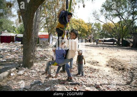 A general view of a slum area near Shakurbasti Railway station in New Delhi, India. This slum is situated on the railway's land. Stock Photo