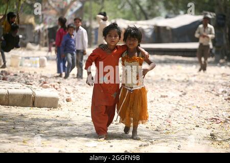 A general view of a slum area near Shakurbasti Railway station in New Delhi, India. This slum is situated on the railway's land. Stock Photo