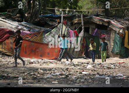 A general view of a slum area near Shakurbasti Railway station in New Delhi, India. This slum is situated on the railway's land. Stock Photo